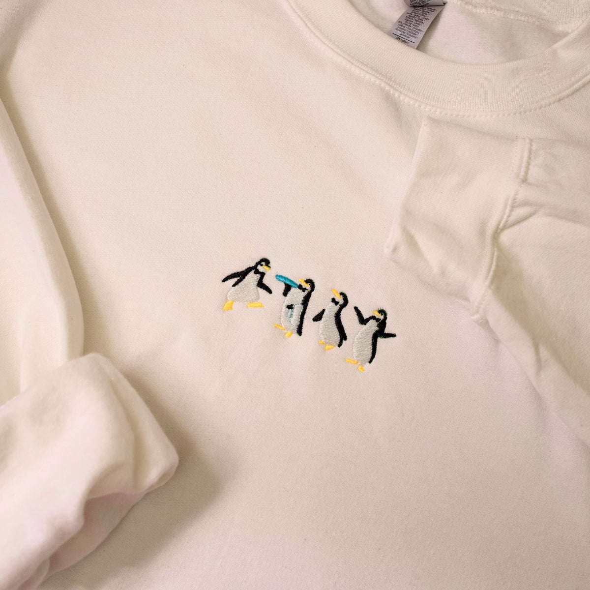 Happy Penguins Embroidered Crewneck and Comfort Tees